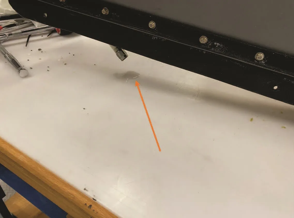 Approximately 1 millilitre (ml) of water came out, when the inlet valve interconnect hose at the LH aft float was disconnected