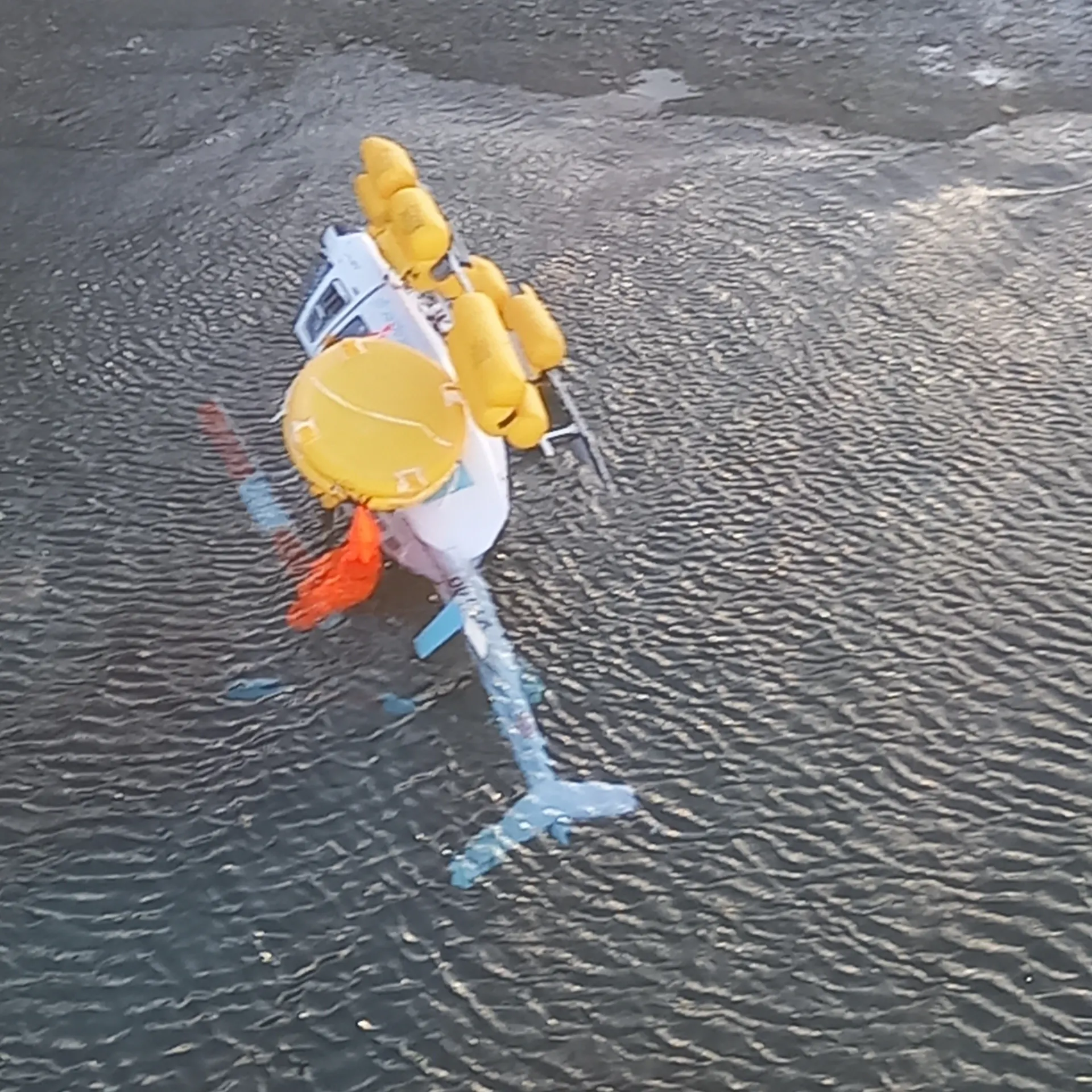 The helicopter laid in the water on its LH side.