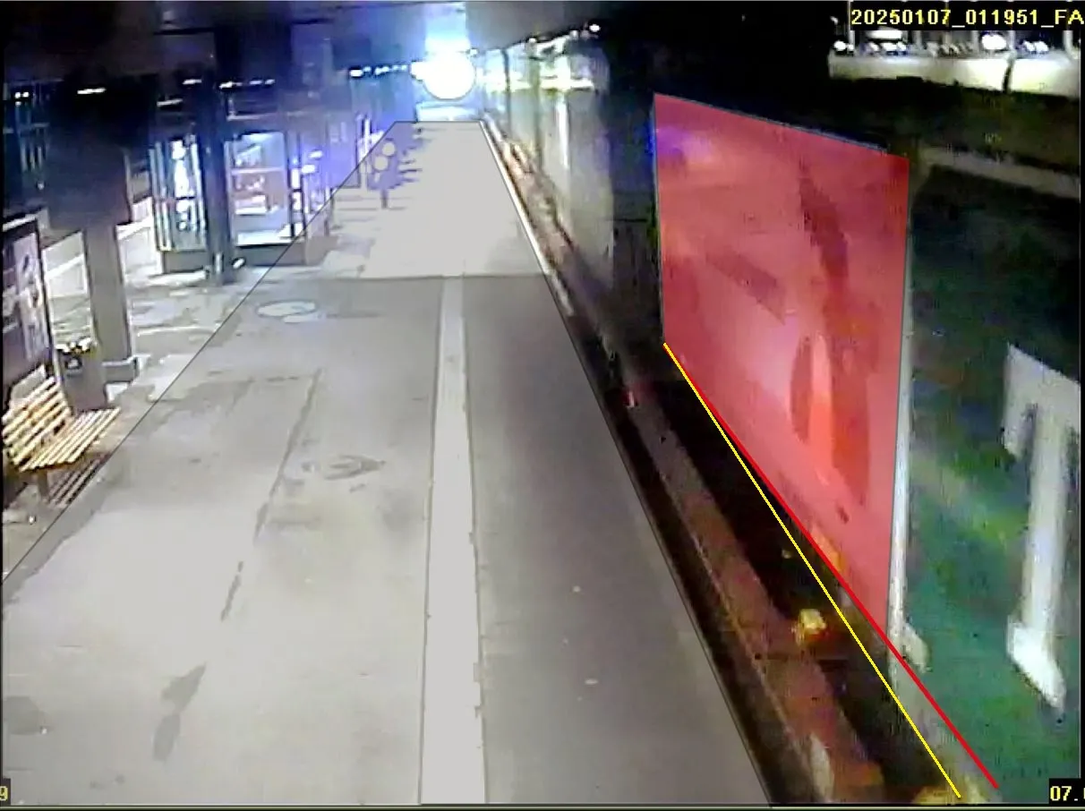 Et foto hvor et veksellad ses forskudt på godsvognen. Perronen i billedet er markeret med transperant grå. Vekselladets side er markeret med transparent rød. En gul linje indikerer den korrekte placering af vekselladet. En rød linje indikerer den aktuelle placering af vekselladet.