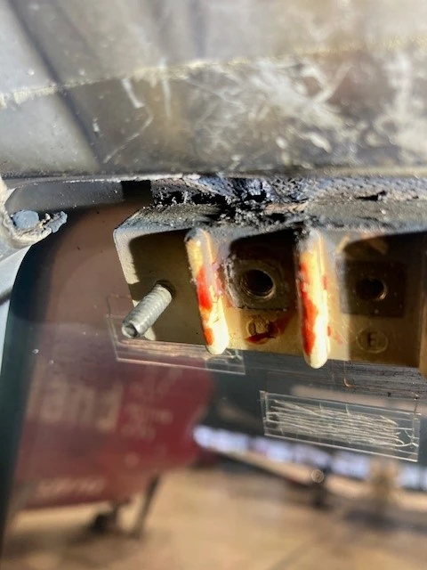 Damage to RH windshield terminal block.